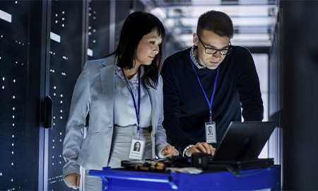 Man and woman looking at computer