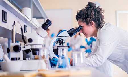 Girl looking in microscope