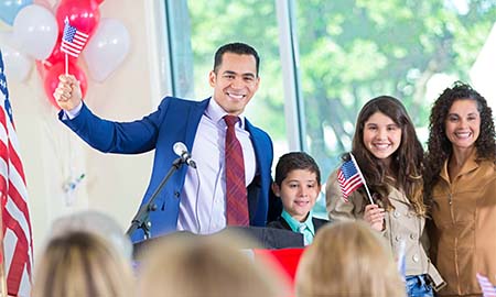 Man ad podium waving flag