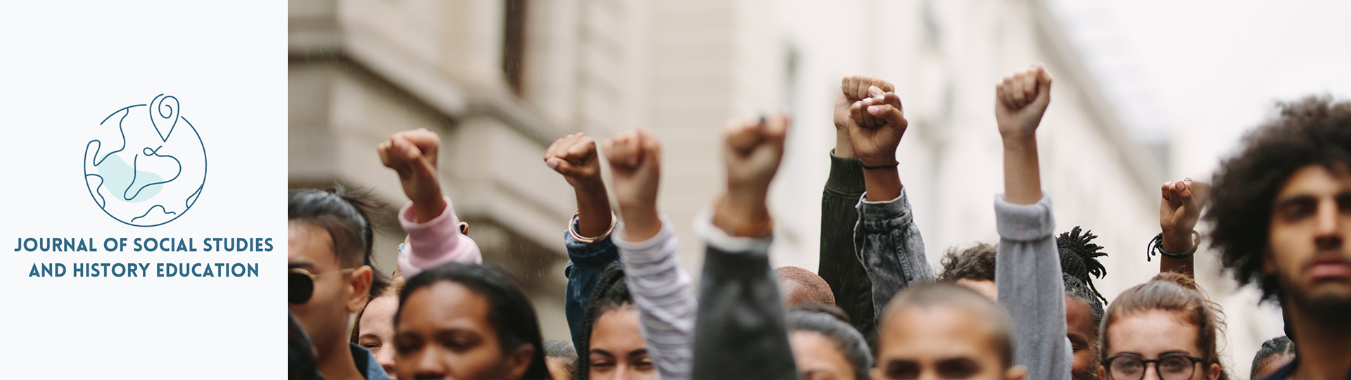 People at a protest with their fist raised.