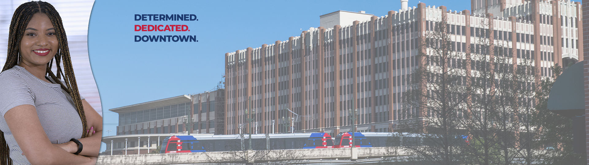 Student next to One Main Building Front Image