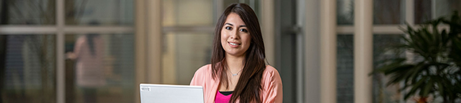 Student sitting with a laptop