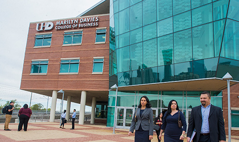 MBA students outside Marilyn Davies College of Business building