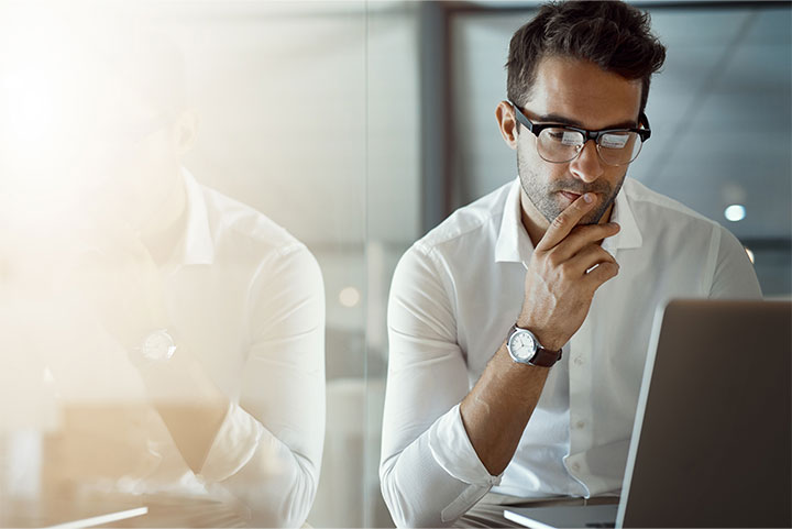 Man looking at a laptop.