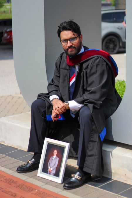 Alexis Mondragon with his father's photo