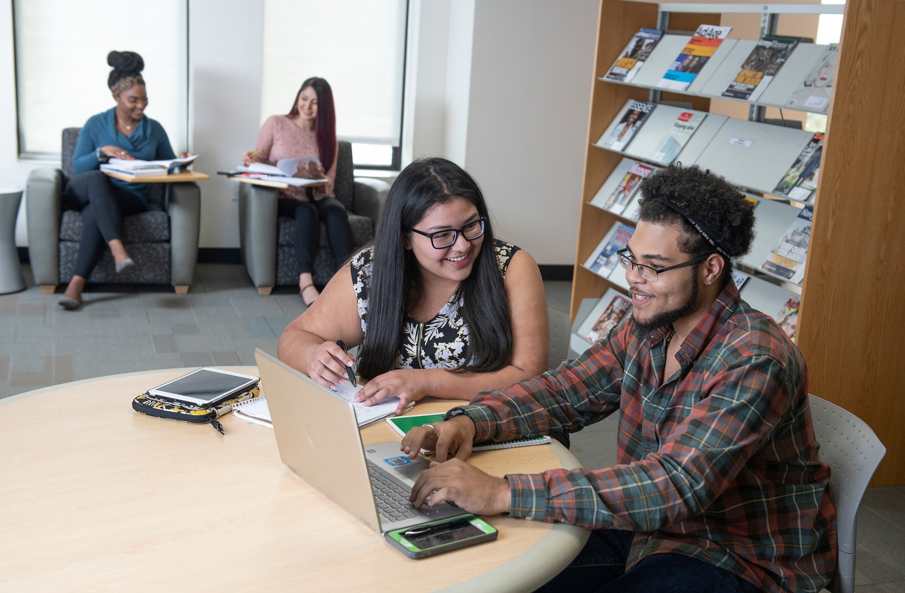 Students sitting in a library