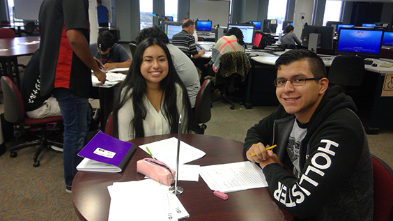 Students smiling for the camera in the Math Lab