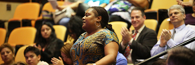 Audience clapping for honoree in the 3rd floor auditorium