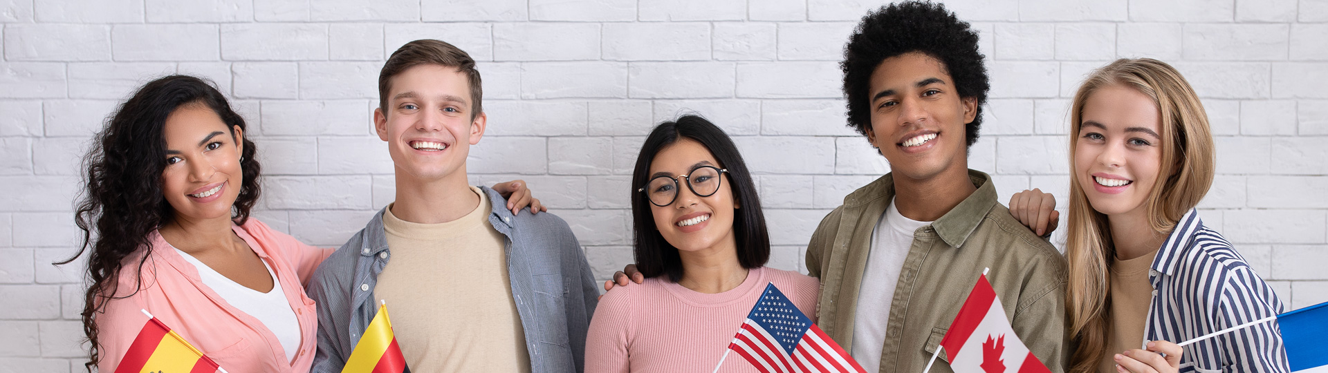 International Students holding flags of different countries