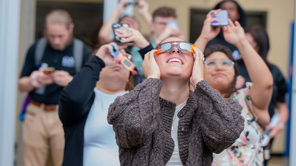 Students looking at the Solar Eclipse