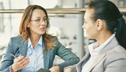 two business women talking