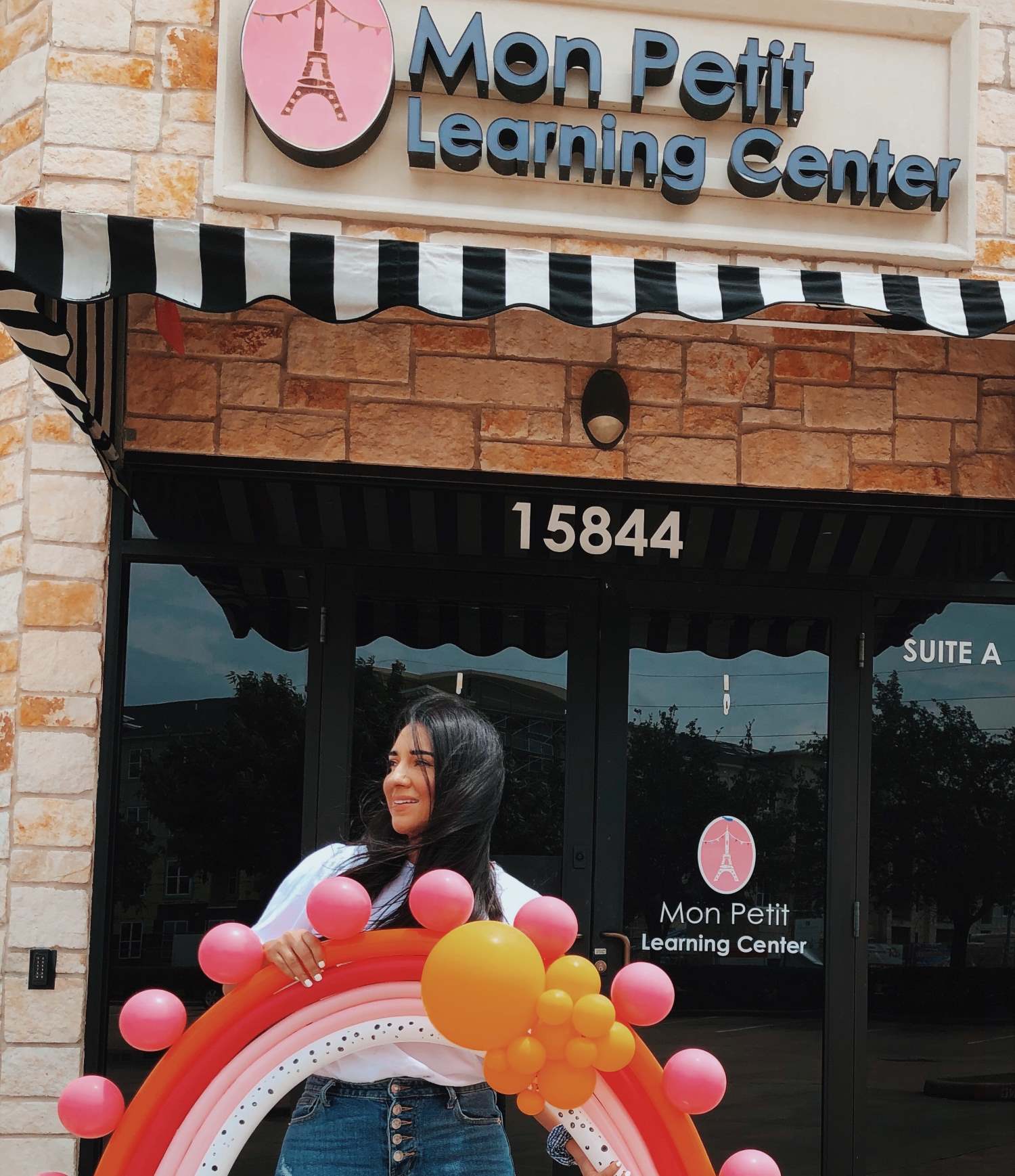 Dulce Martinez Rangel in front of her childcare learning center, Mon Petit